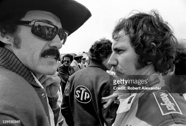 Race car driver Richard Petty, left, talks with fellow driver Dale Earnhardt Sr. Prior to drivers' introductions at the 1982 Daytona 500 on February...