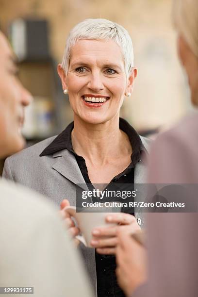 business people talking in office - rf business stock pictures, royalty-free photos & images