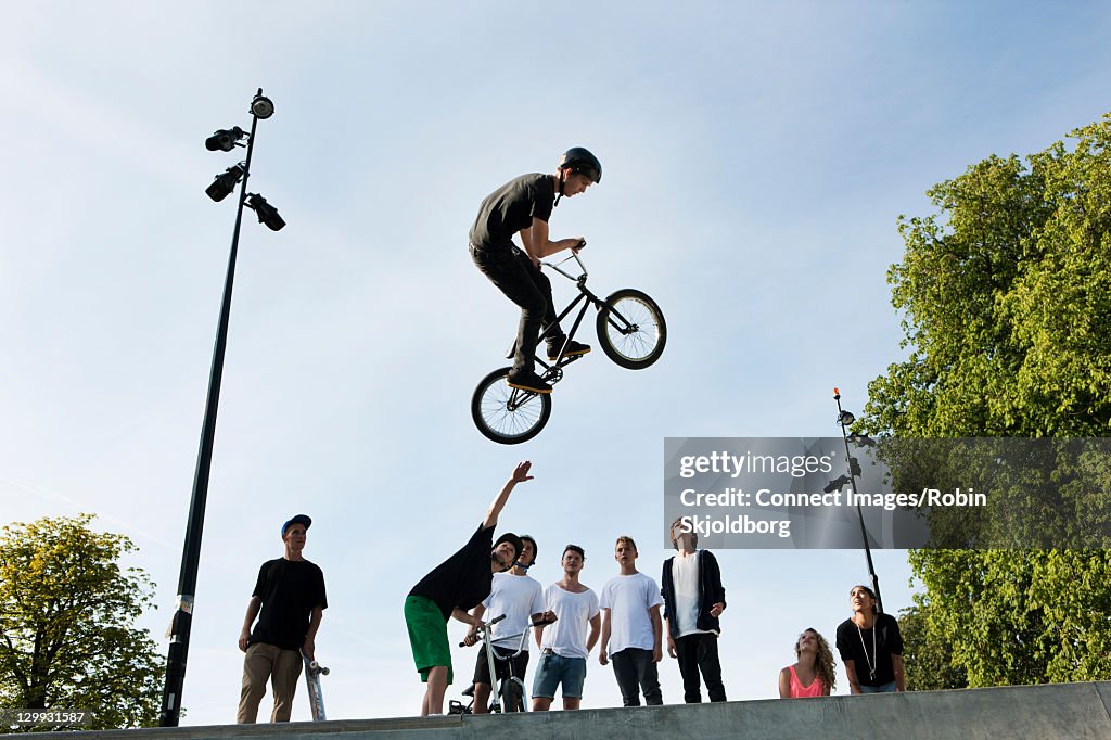 Teenager doing tricks on bmx bike