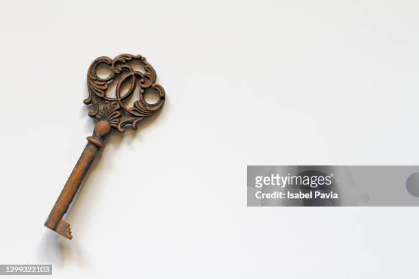 vintage key on white - ornate key stock pictures, royalty-free photos & images