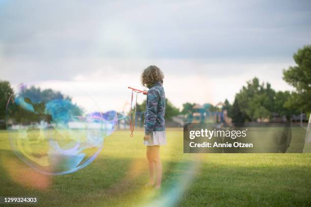 giant bubble - big soap bubble stock pictures, royalty-free photos & images