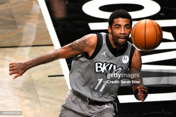 Kyrie Irving of the Brooklyn Nets chases a ball during the second half against the Miami Heat at Barclays Center on January 25, 2021 in the Brooklyn...