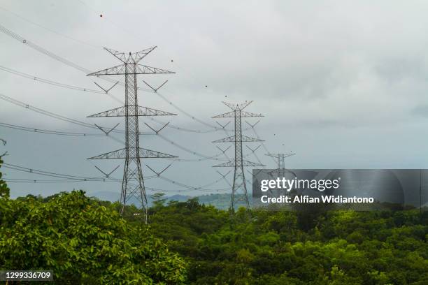 pylons on the mountainous area - hill range stock pictures, royalty-free photos & images