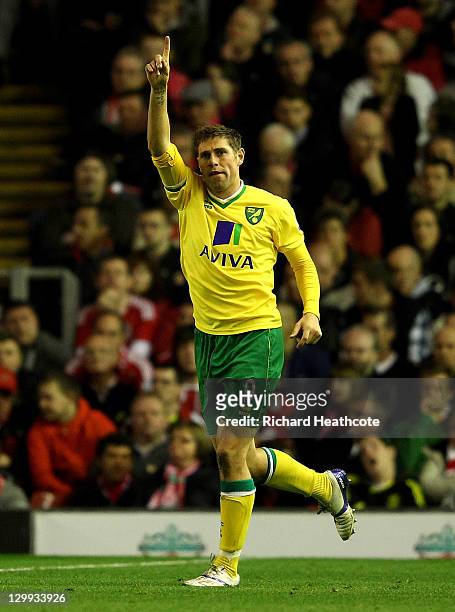 Grant Holt of Norwich City celebrates scoring his team's first goal during the Barclays Premier League match between Liverpool and Norwich City at...