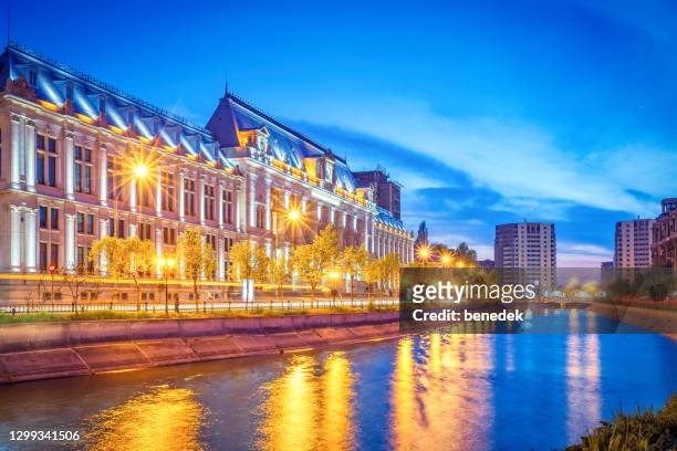 palace of justice and dambovita river in downtown bucharest romania - bucharest stock pictures, royalty-free photos & images
