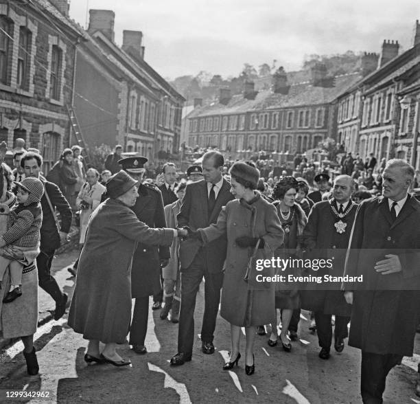 Queen Elizabeth II and the Duke of Edinburgh visit the coal mining village of Aberfan in Wales, following the disaster which resulted in the deaths...