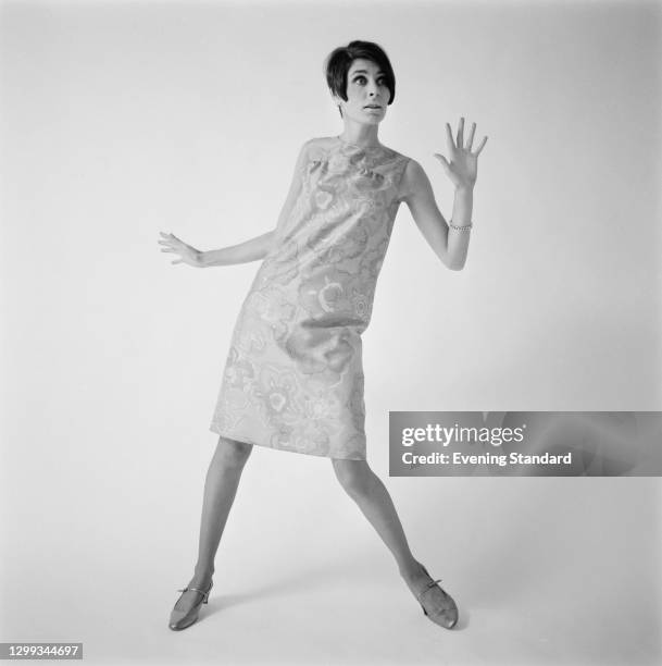 Model wearing a silk shift dress with a floral pattern, UK, 31st October 1966.