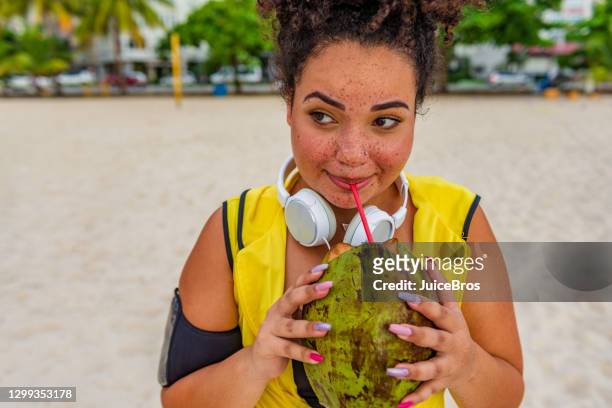 active young brazilian sports woman - coconut water stock pictures, royalty-free photos & images