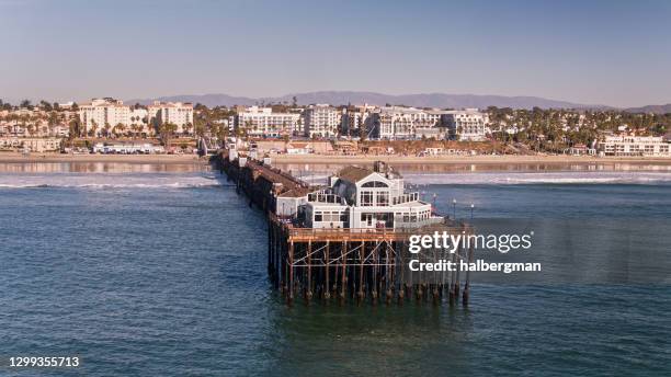 drone shot of end of the pier in oceanside, california - oceanside pier stock pictures, royalty-free photos & images