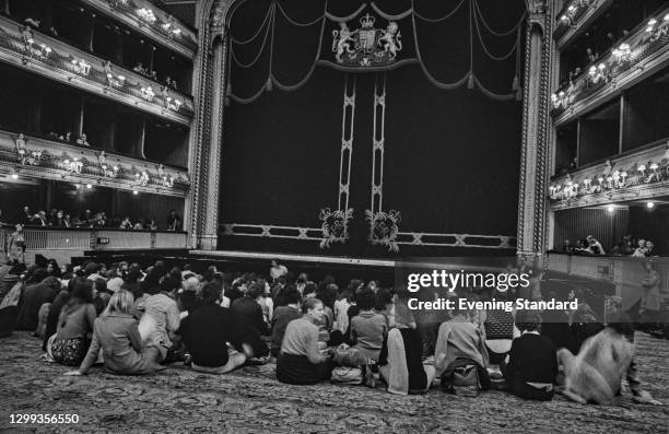 Audience members sitting on the floor at the Royal Opera House in London, UK, during the BBC Proms, 2nd October 1972.