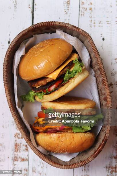 burgers - cheeseburger stock pictures, royalty-free photos & images