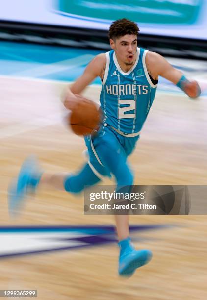 LaMelo Ball of the Charlotte Hornets brings the ball up court during the third quarter of their game against the Indiana Pacers at Spectrum Center on...