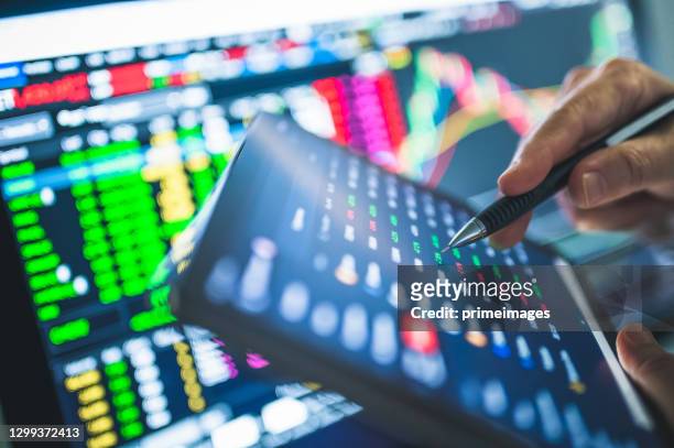 online business trade with mobile app using ticker bid - offer before fundamental analysis and financial graph in stockmarket forex cryptocurrency and commodity abstract backgroun - bid offer stock pictures, royalty-free photos & images
