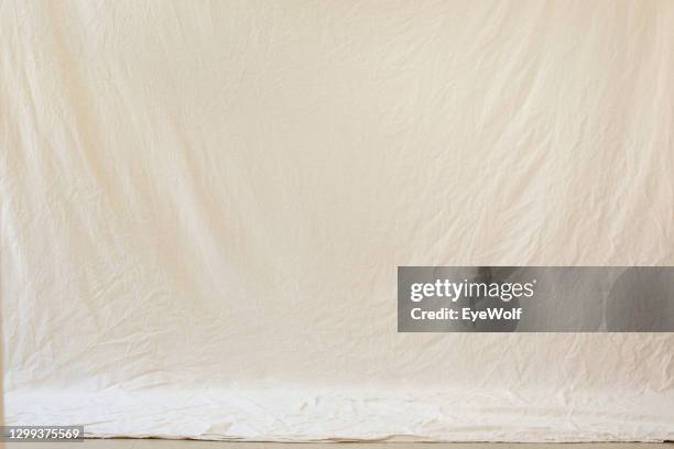 an studio backdrop setup with a natural looking drop cloth with no people - protective sheet stock pictures, royalty-free photos & images