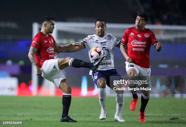 Mario Osuna and Angel Mendoza of Mazatlan figt for the ball with Edgar Pardo of Pachuca during the 4th round match between Mazatlan FC and Pachuca as...