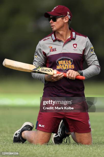 Fire coach Ashley Noffke hits catches during warm up before play in the WNCL match between the Queensland Fire and ACT Meteors at EPC Solar Park on...