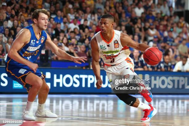 Scott Machado of the Taipans drives to the basket during the round three NBL match between the Brisbane Bullets and the Cairns Taipans at Nissan...