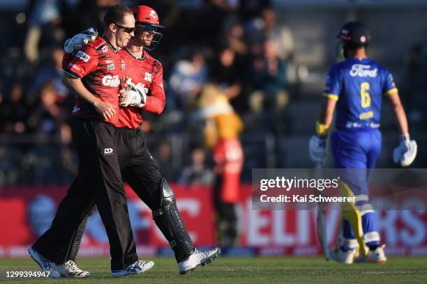 Todd Astle of the Kings is congratulated by Cameron Fletcher of the Kings after dismissing Neil Broom of the Volts during the Super Smash T20 match...