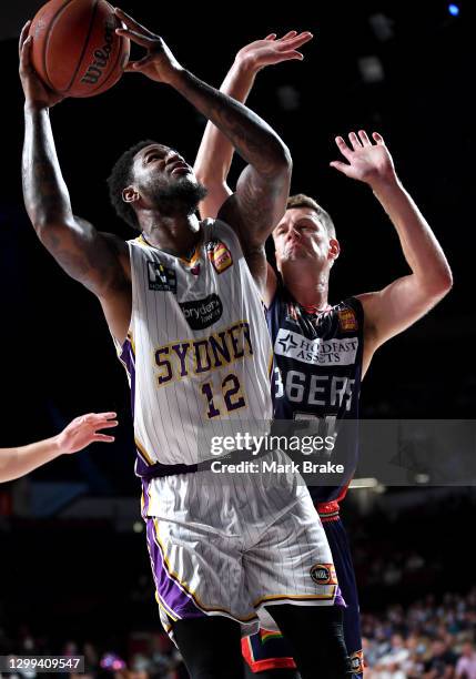 Jarell Martin of the Kings heads for the basket defended by Daniel Johnson of the 36ers during the round three NBL match between the Adelaide 36ers...