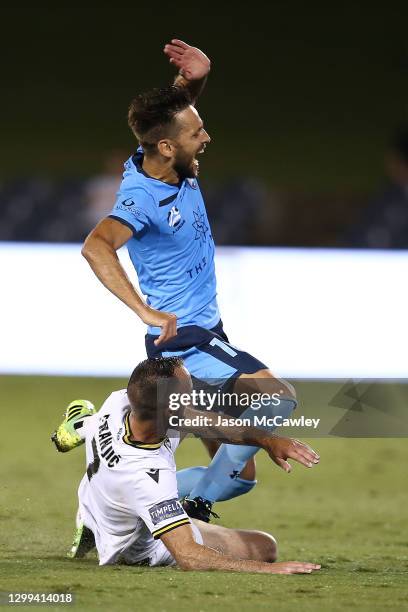 Milos Ninkovic of Sydney FC is challenged by Ivan Franjic of the Bulls during the A-League match between Macarthur FC and Sydney FC at Campbelltown...