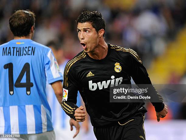 Cristiano Ronaldo of Real Madrid celebrates after scoring his 3rd goal during the La Liga match between Malaga CF and Real Madrid CF at Estadio La...