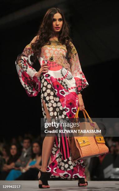 Model presents a creation of designer Ammar Belal on PFDC Sunsilk Fashion Week in Karachi on October 22, 2011. AFP PHOTO/ Rizwan TABASSUM