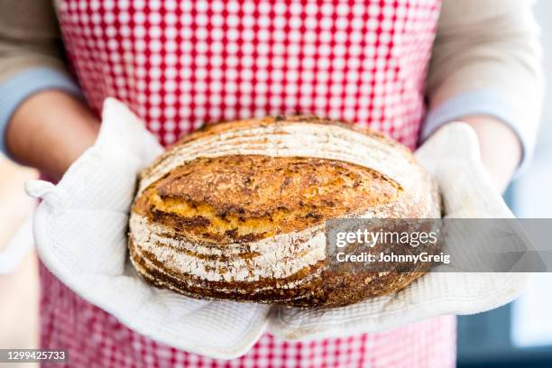 portrait of fresh porridge loaf with oats and linseed - round loaf stock pictures, royalty-free photos & images