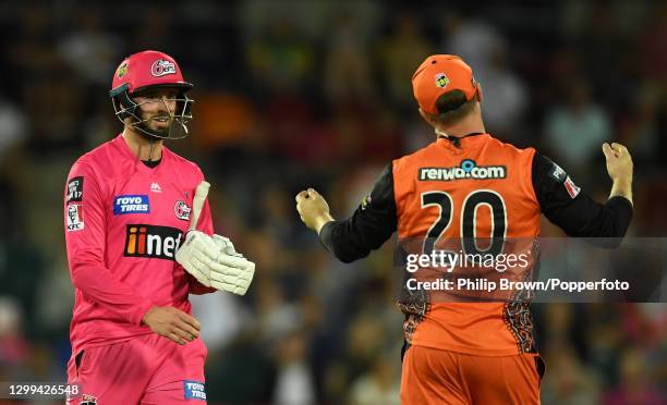 James Vince of Sixers looks at Jason Roy of Scorchers after a wide bowled by Andrew Tye gave Sixers the win in the Big Bash League match between the...