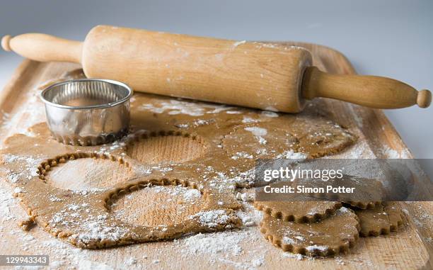 raw cookies with dough and rolling pin - rolling pin stock pictures, royalty-free photos & images