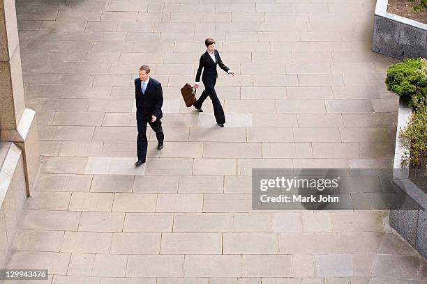 business people walking in courtyard - man walking top view stock pictures, royalty-free photos & images