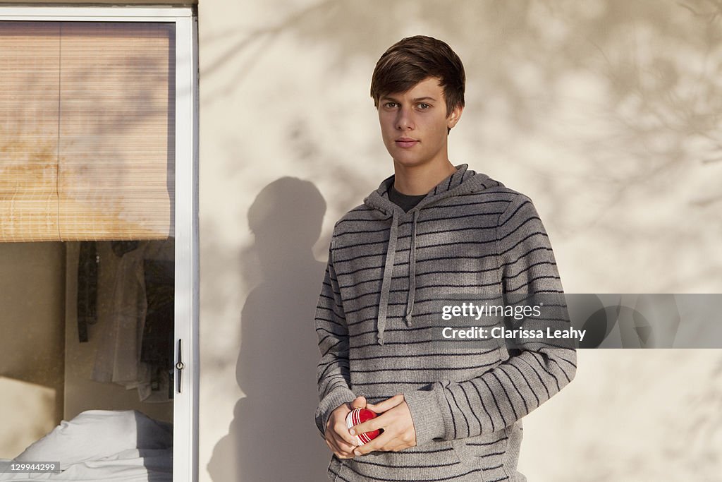 Teenage boy standing outdoors