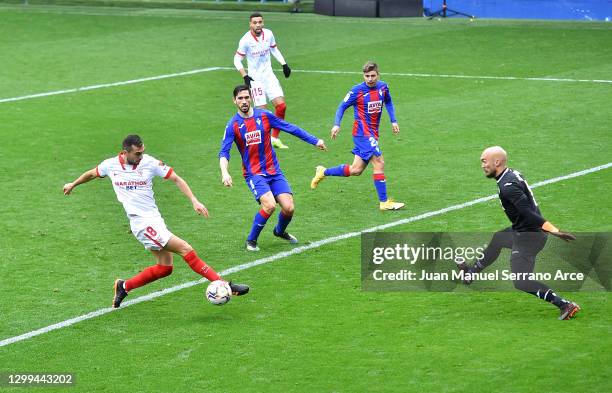 Joan Jordan of Sevilla scores his team's second goal past Marko Dmitrovic of SD Eibar during the La Liga Santander match between SD Eibar and Sevilla...