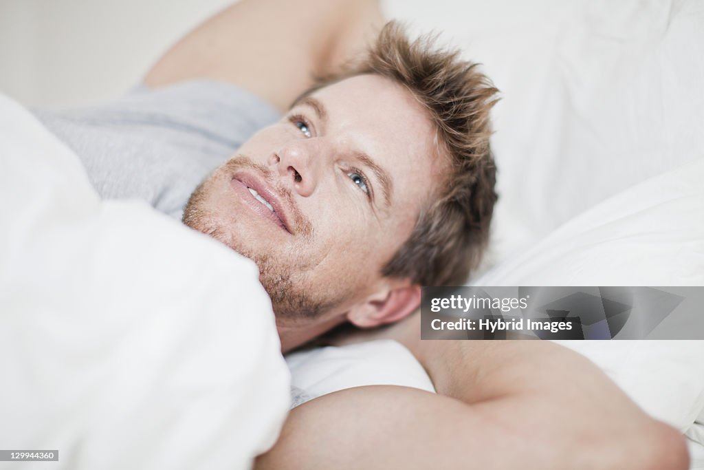 Close up of man relaxing in bed