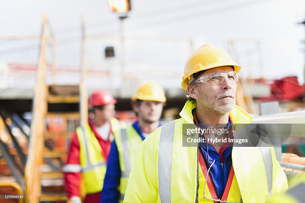 Workers walking on oil rig