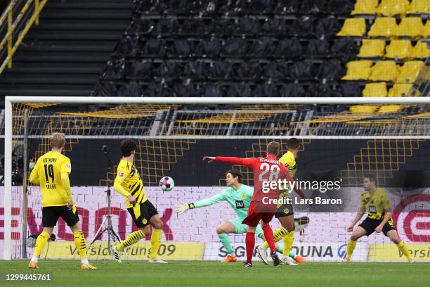 Andre Hahn of FC Augsburg scores his team's first goal past Marwin Hitz of Borussia Dortmund during the Bundesliga match between Borussia Dortmund...
