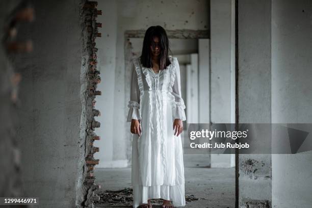 the ghost of sao jong looked bitterly at the abandoned building. - zombie face stock pictures, royalty-free photos & images