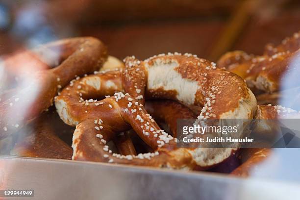 close up of salted pretzel - brezel stock-fotos und bilder
