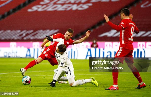 Sebastian Rudy of TSG 1899 Hoffenheim and Joshua Kimmich of FC Bayern Munich battle for possession during the Bundesliga match between FC Bayern...