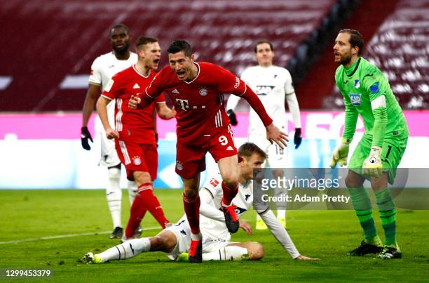 Robert Lewandowski of FC Bayern Munich celebrates after scoring his team's third goal during the Bundesliga match between FC Bayern Muenchen and TSG...