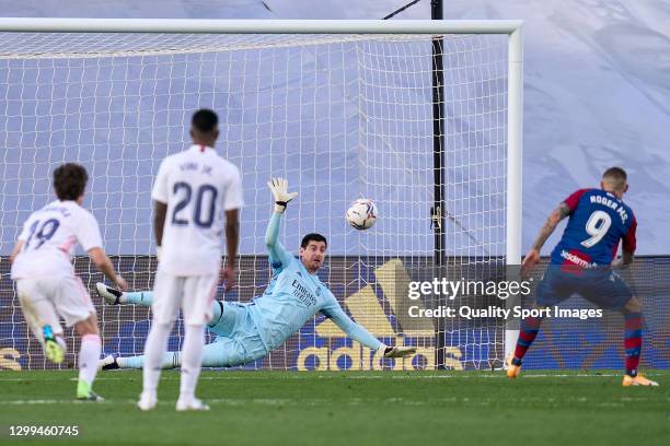 Thibaut Courtois of Real Madrid stops a penalty during the La Liga Santander match between Real Madrid and Levante UD at Estadio Alfredo Di Stefano...