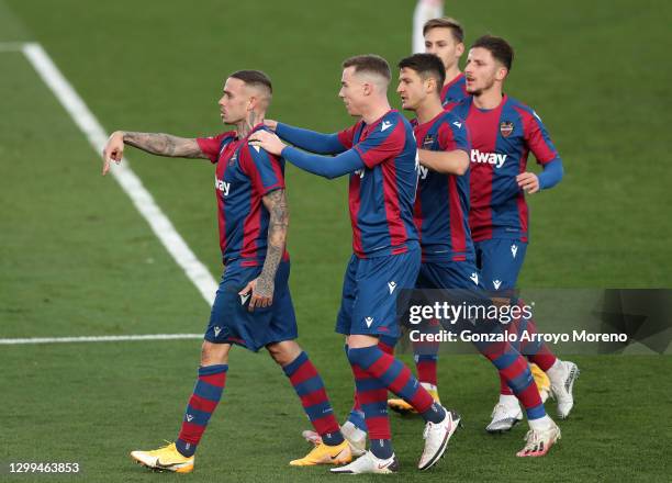 Roger of Levante UD celebrates with teammates after scoring his team's second goal during the La Liga Santander match between Real Madrid and Levante...