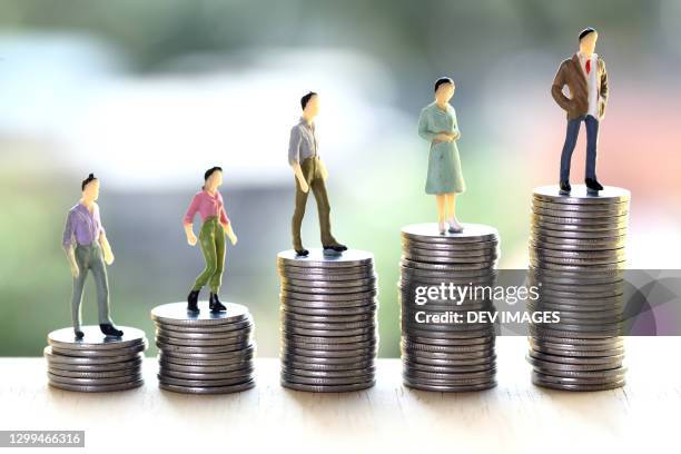 concept of money savings-stack of coins - representación humana fotografías e imágenes de stock