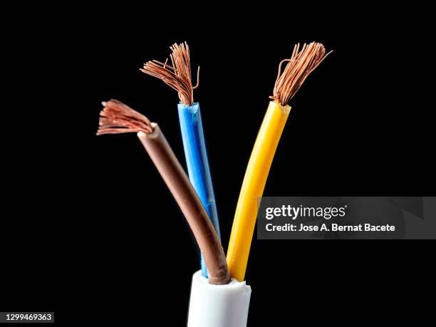 stripped copper electrical power cables wire on black background. - cable installer stockfoto's en -beelden