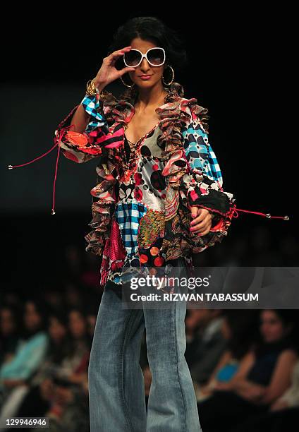 Model presents a creation by Pakistani designer Ammar Belal during the PFDC Sunsilk Fashion Week in Karachi on October 22, 2011. AFP PHOTO/ RIZWAN...