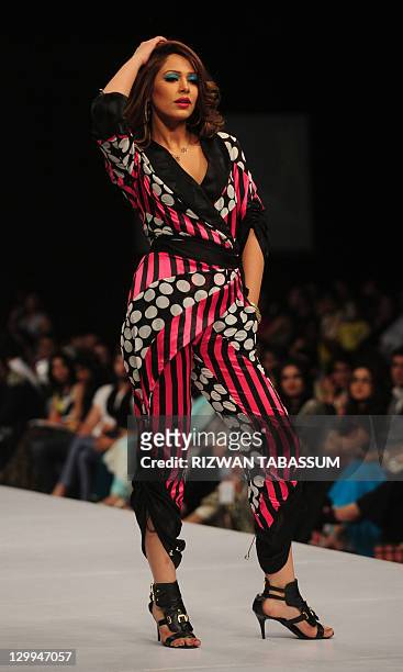 Model presents a creation by Pakistani designer Ammar Belal during the PFDC Sunsilk Fashion Week in Karachi on October 22, 2011. AFP PHOTO/ Rizwan...