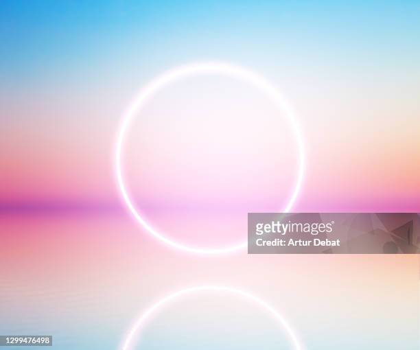 perfect neon ring glowing at sunrise sky levitating over the sea. - future space stockfoto's en -beelden
