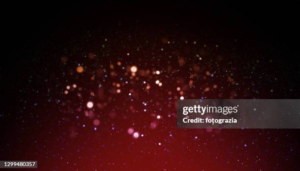 defocused particles abstract background - glamour fotografías e imágenes de stock