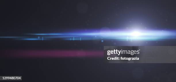 lens flare light on dark panoramic background - glamour photos et images de collection