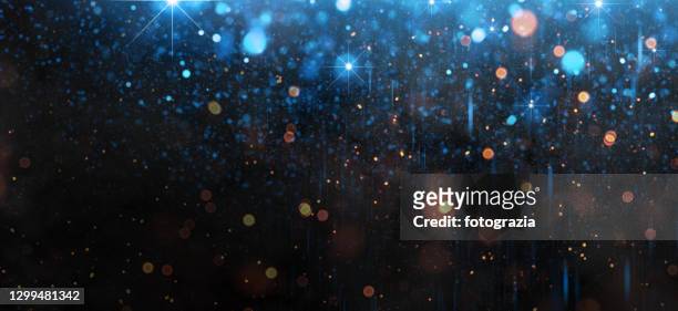 defocused lights and particles abstract background - magie stock-fotos und bilder
