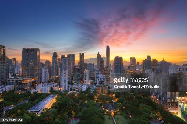 high rise view of bangkok city in downtown business district at sunset - bangkok hotel stock pictures, royalty-free photos & images